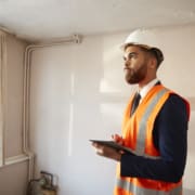 inspector doing residential building inspection scaled