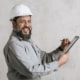 home inspector writing on clipboard replying to does a home inspection affect the appraisal scaled
