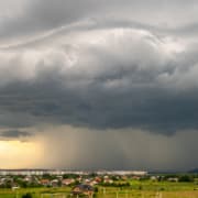 wondering about home inspection before hurricane season when seeing this landscape with storm clouds scaled